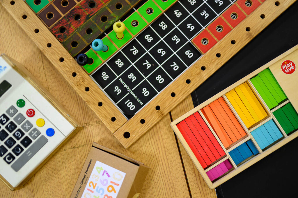 board with numbers, coloured strips and a calculator | Ducklings Nursery